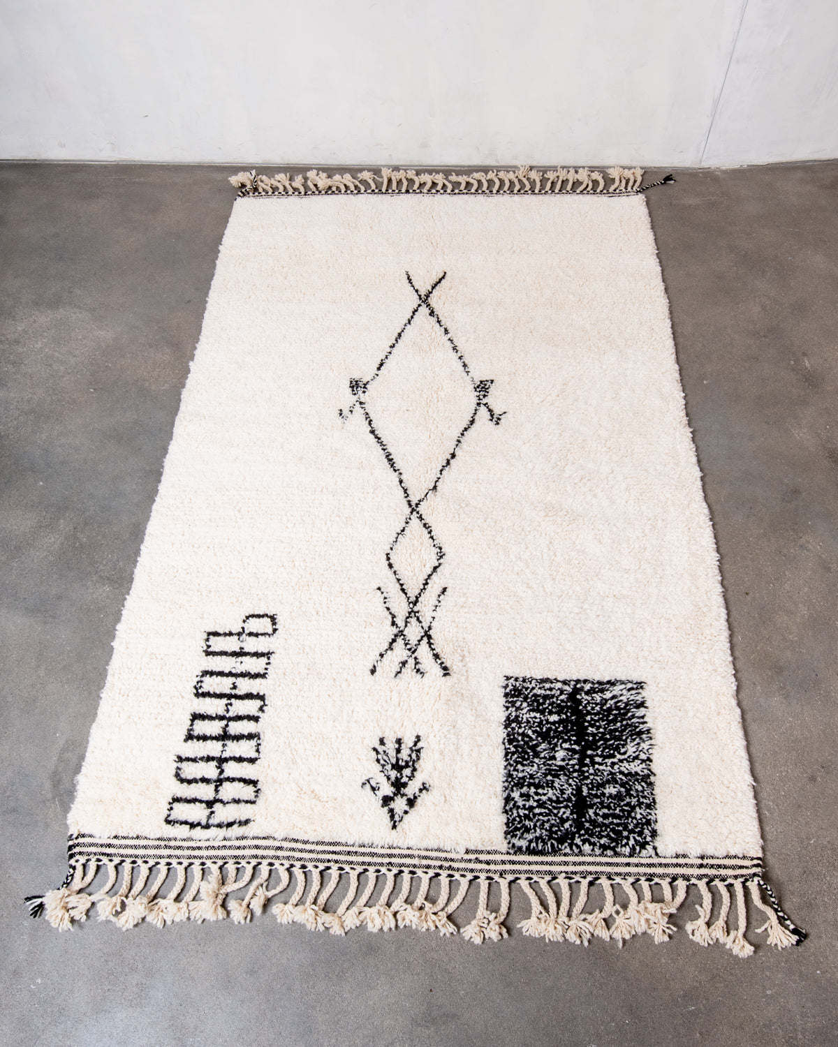 Modern, designer, handcrafted Berber rug from Morocco. Beniourain carpet with minimalist design, natural wool pile and a fluffy texture.